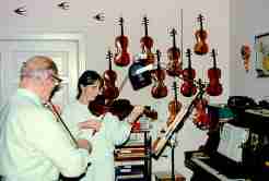 Fiddler and his home made violins
